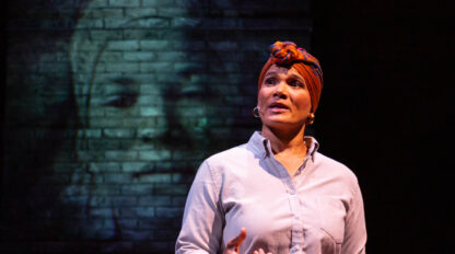 woman delivering monologue in performance on stage.