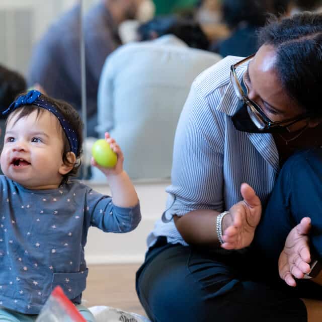 Baby and Caregiver at Music Class