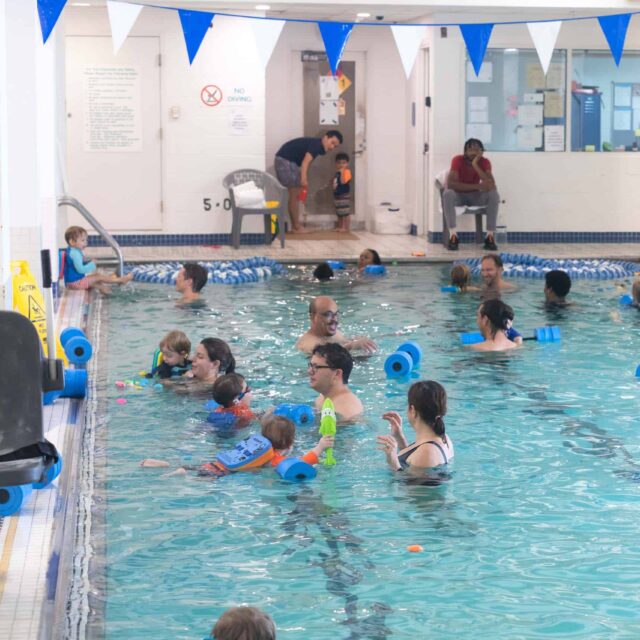 people in an indoor pool.