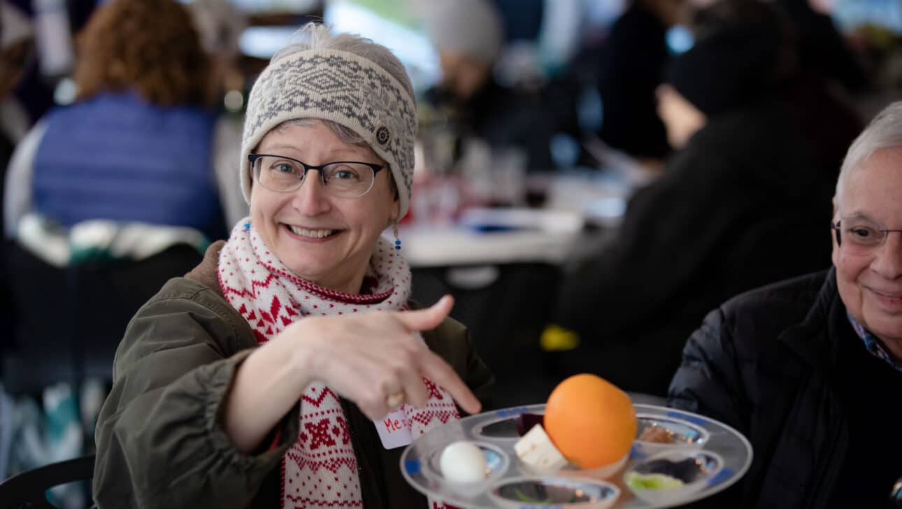 woman pointing at a dish.