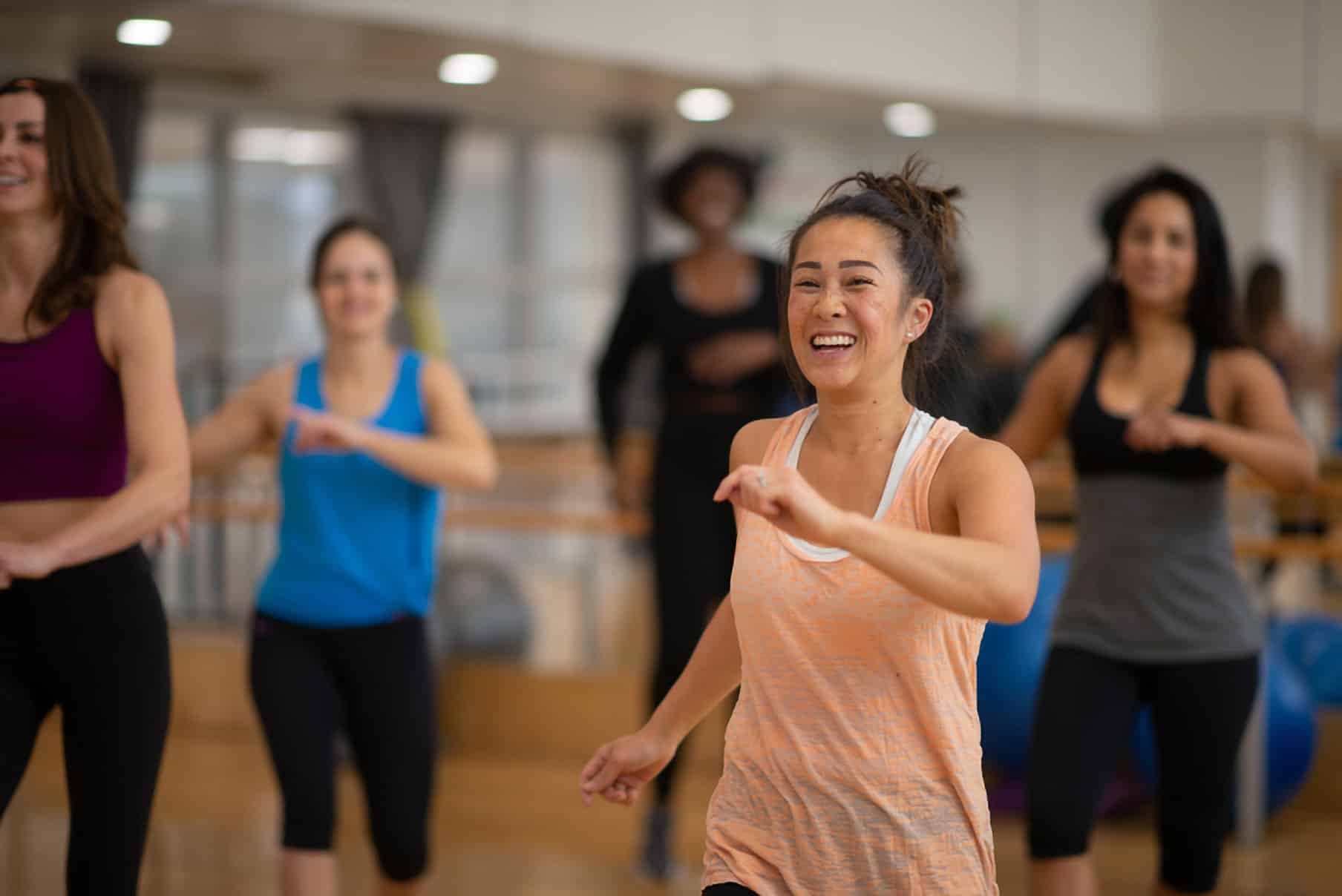 women dancing in a fitness class.