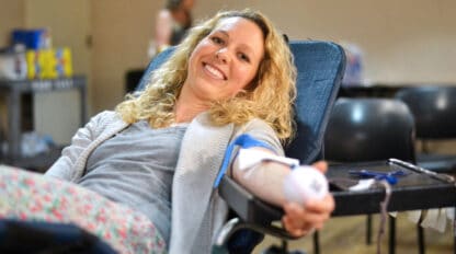 Woman reclining in chair donating blood