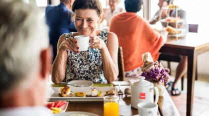 Older adult enjoying brunch at table