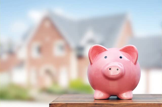 Image of piggy bank with house in background, estate planning