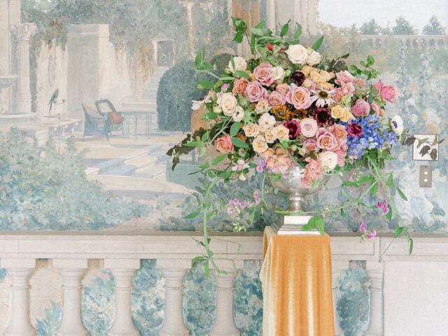 bouquet of flowers set against historic mural